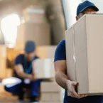 Couriers Unloading Parcels from Van